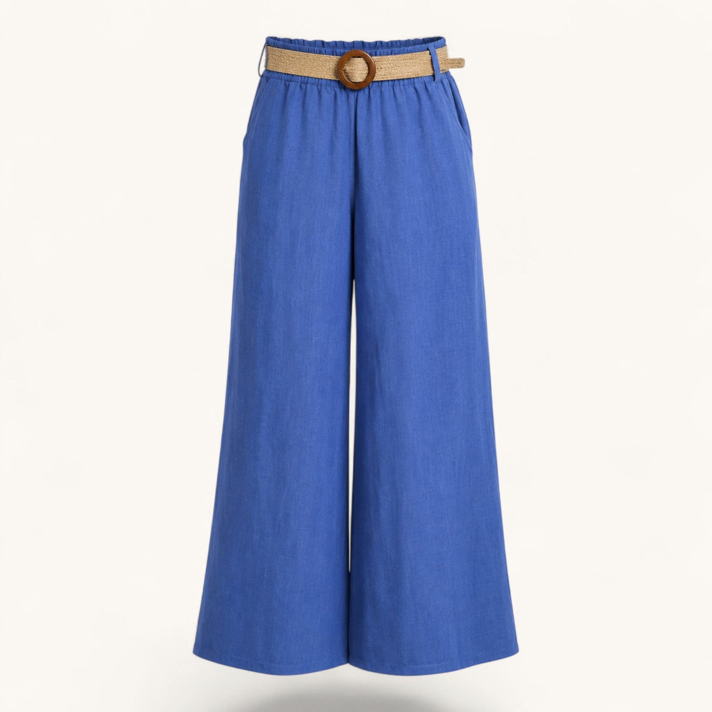 Feather & Sole blue linen trousers with an elasticated waist and raffia belt.