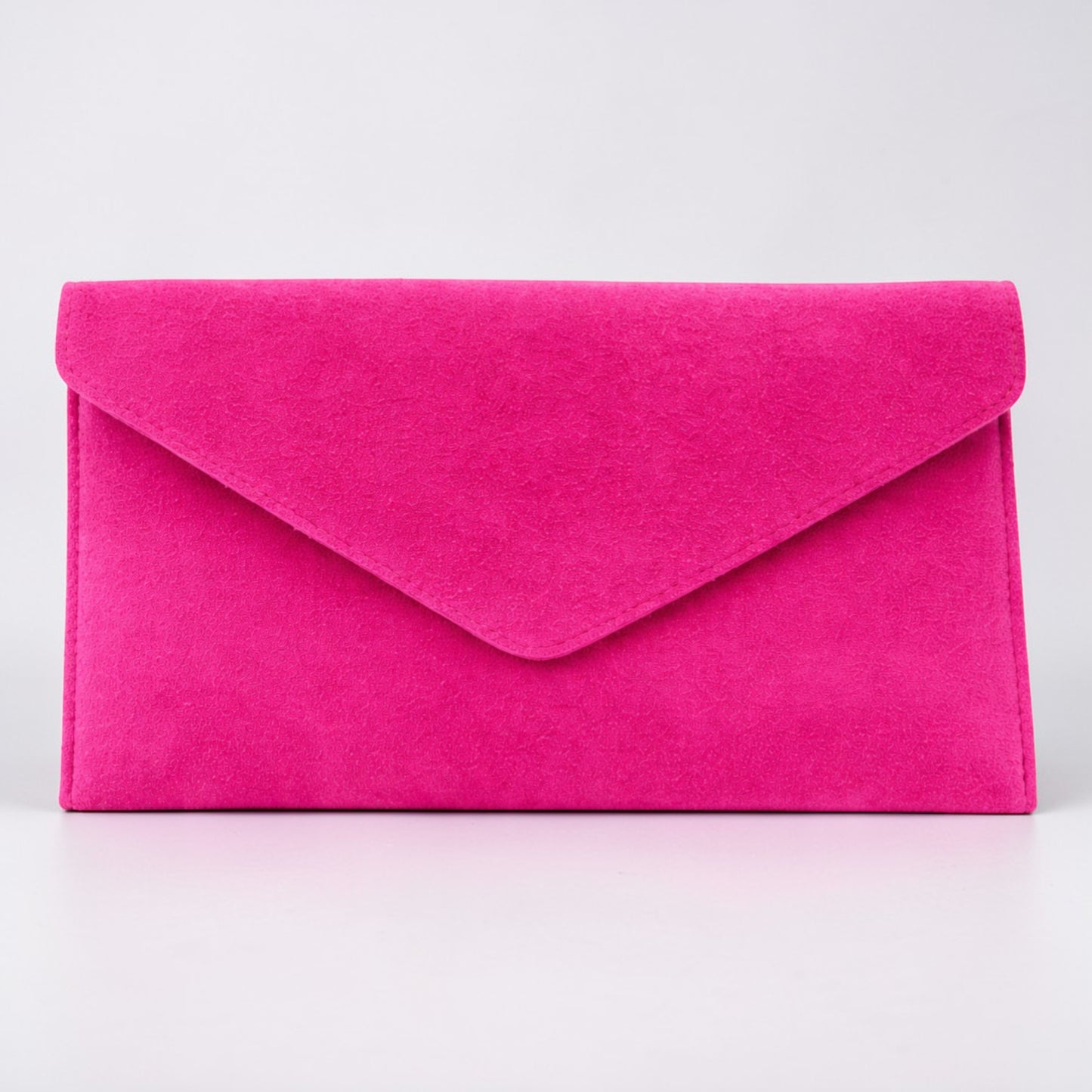 Pink clutch bag on a light gray background