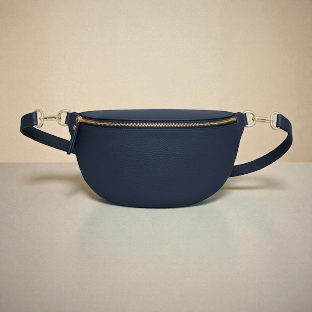 Feather & Sole navy blue Italian genuine leather crescent crossbody bum bag with gold hardware and zipper closure.