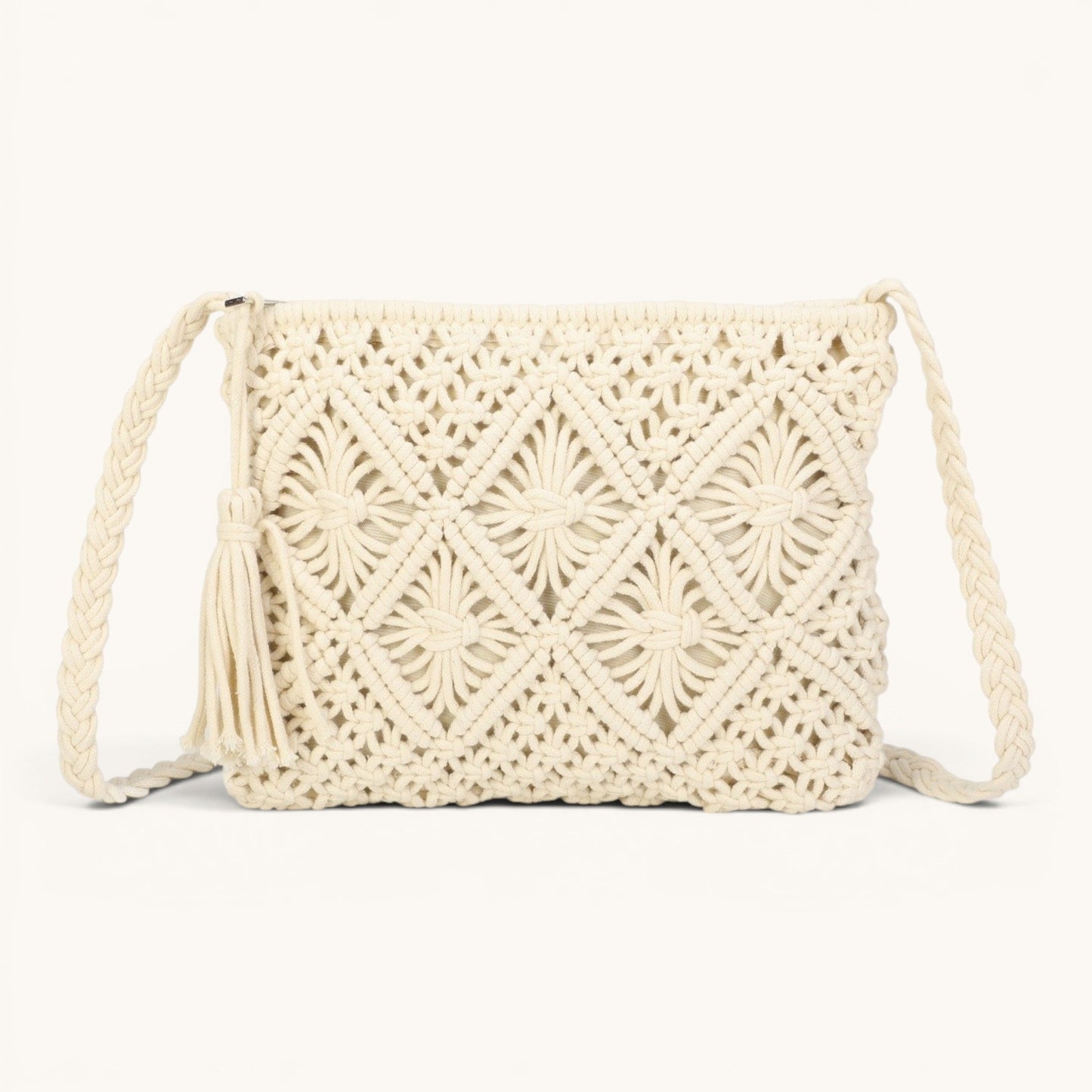 Feather & Sole Macrame Woven Crossbody Shoulder Bag in cream with tassel detail and braided strap.