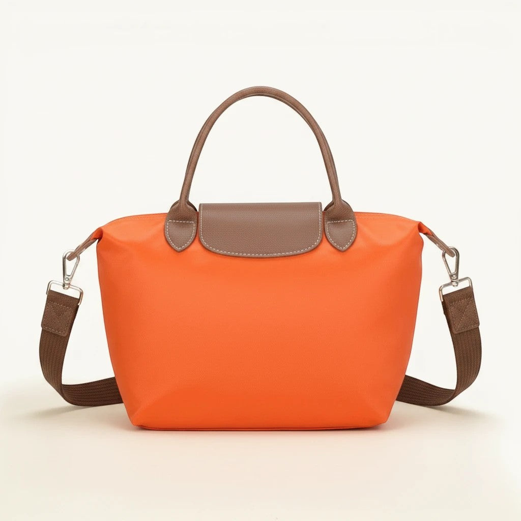 Feather & Sole orange nylon satchel handbag with brown faux leather trim and shoulder strap.