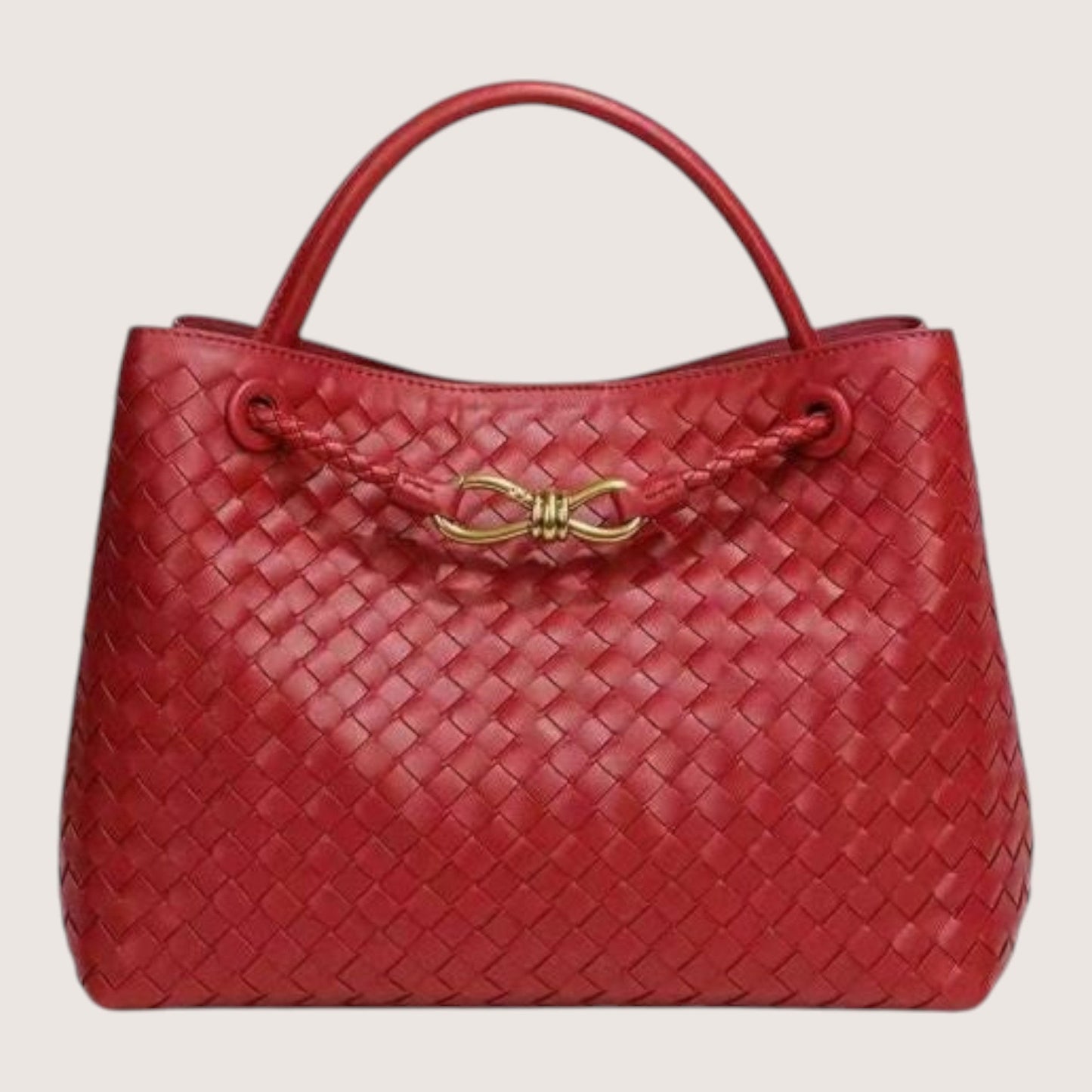 Feather & Sole red woven leather tote bag with braided detail and gold-tone clasp closure.