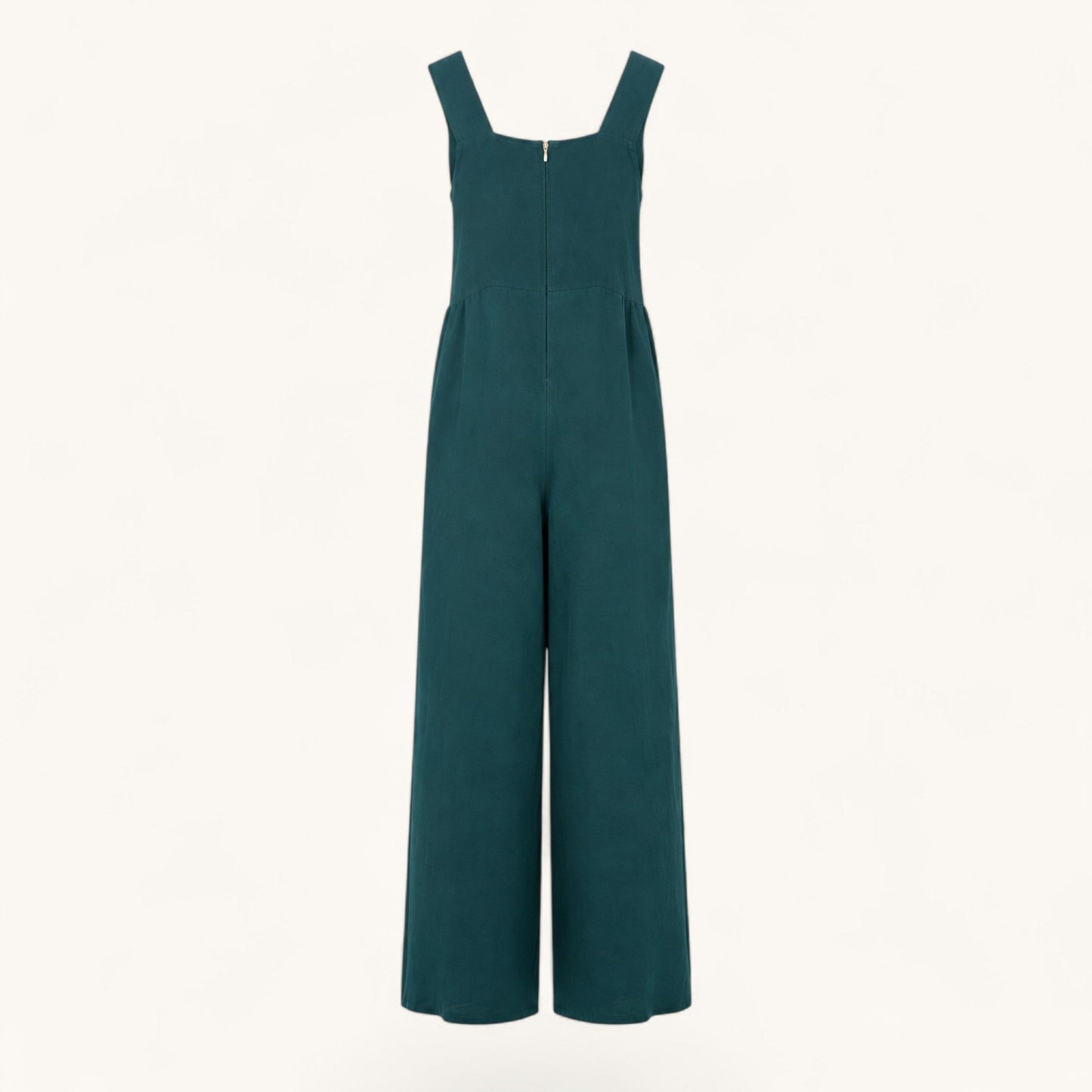 Feather & Sole teal linen jumpsuit featuring a square neckline, wide legs, and a back zipper closure.