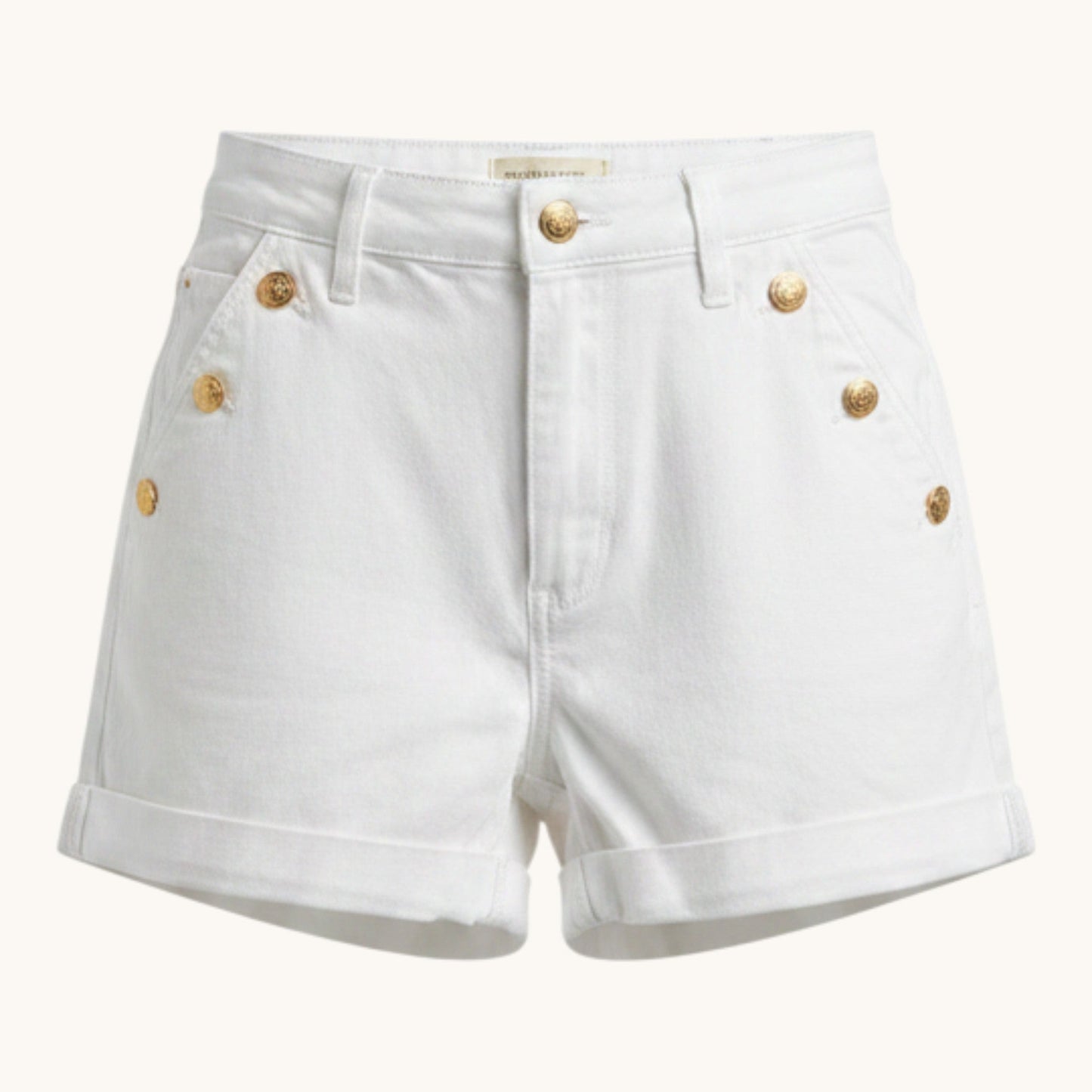 Feather & Sole white high-waisted denim shorts with gold-tone button details and cuffed hems.