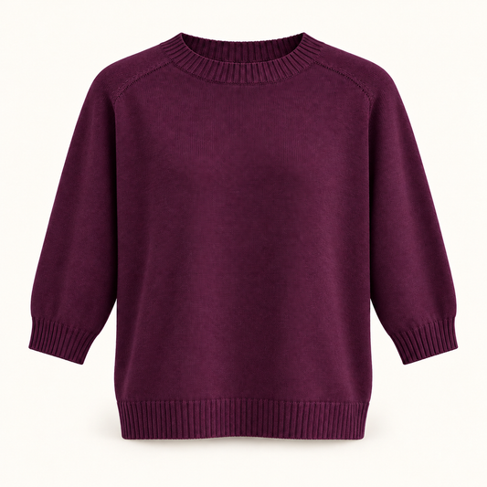 A long-sleeve crewneck knit sweater in a deep plum purple color, displayed on a clean off-white background.