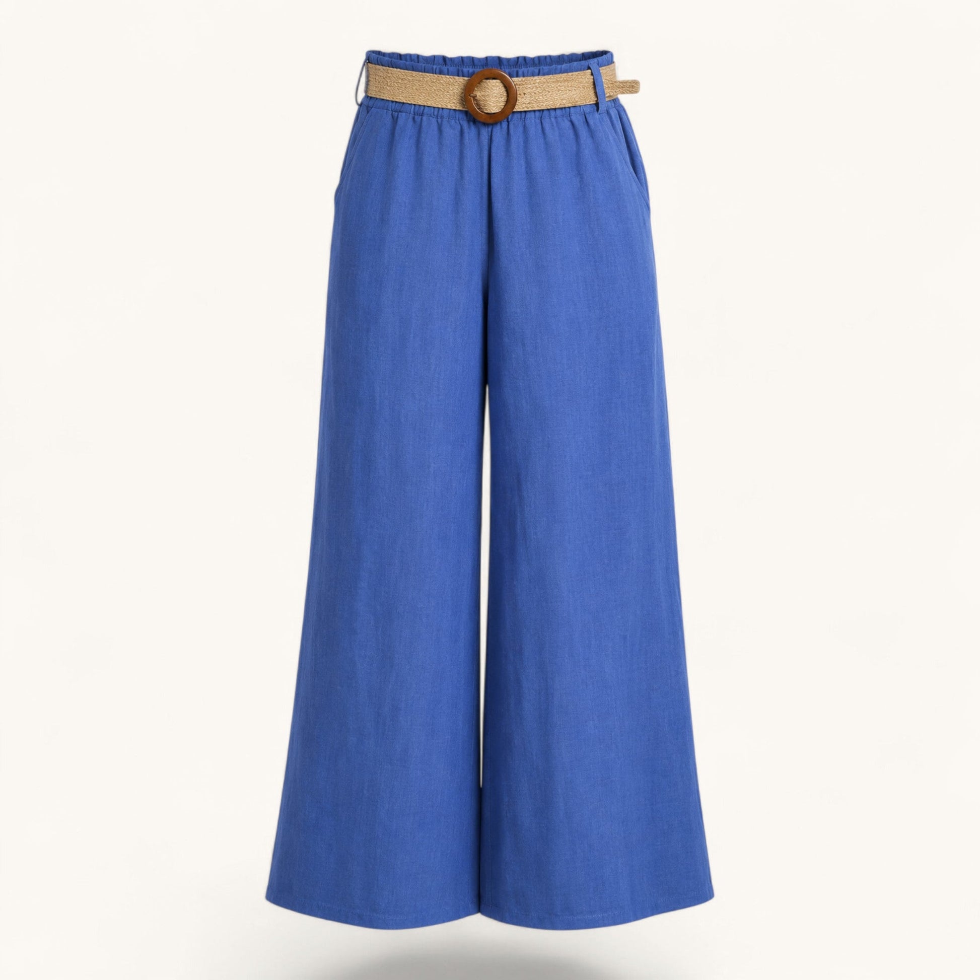 Feather & Sole blue linen trousers with an elasticated waist and raffia belt.