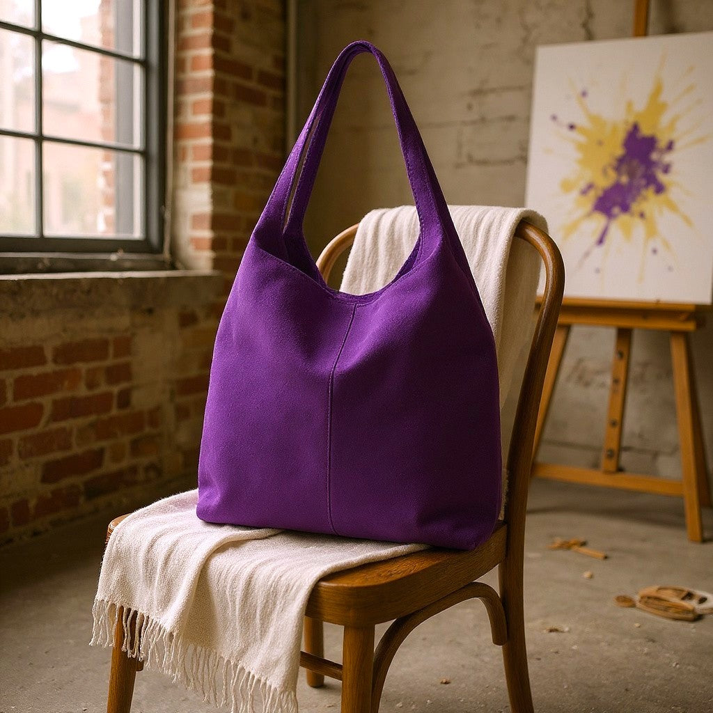 Purple bag on a wooden chair with a brick wall and abstract painting in the background