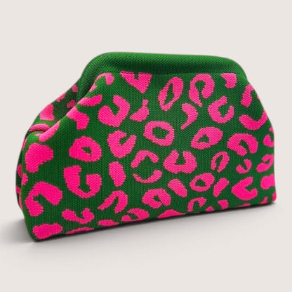 Feather & Sole green knit clutch with hot pink leopard print. Textured pouch-style handbag with structured frame.