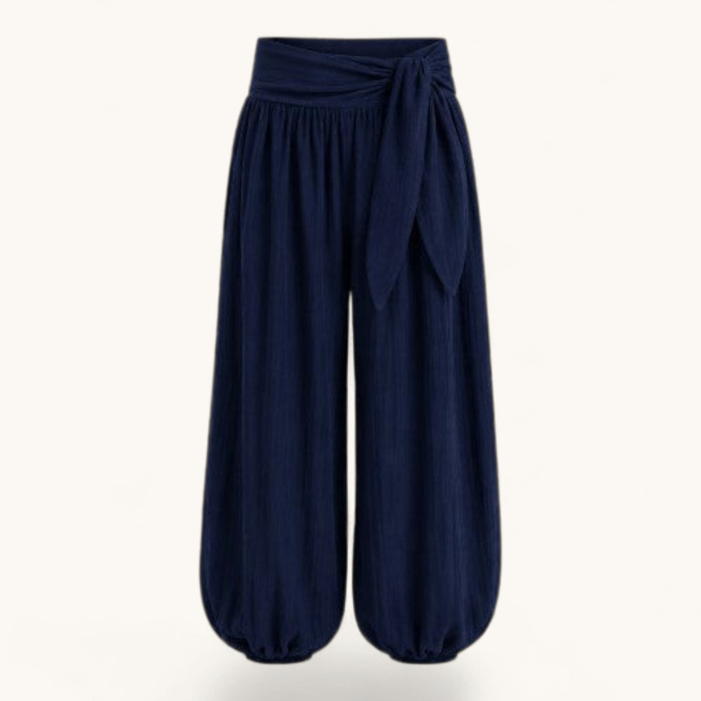 Feather & Sole navy blue high-waisted balloon trousers with a tie-front detail and gathered elasticated cuffs.