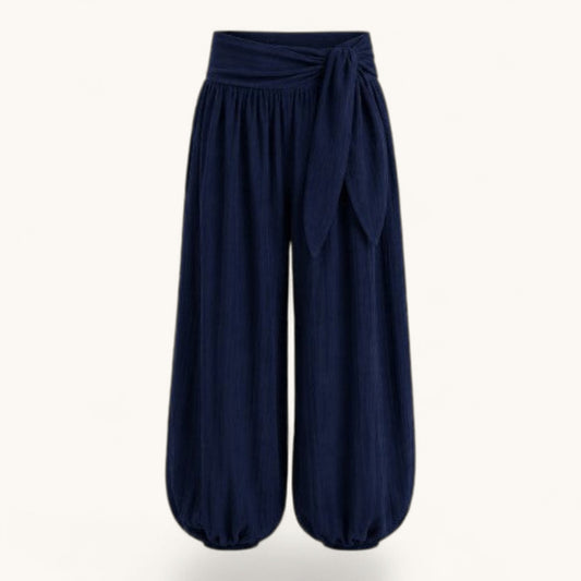 Feather & Sole navy blue high-waisted balloon trousers with a tie-front detail and gathered elasticated cuffs.
