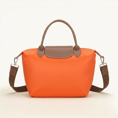 Feather & Sole orange nylon satchel handbag with brown faux leather trim and shoulder strap.