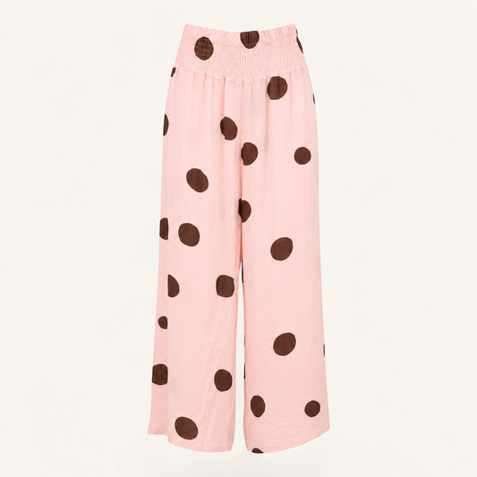 Feather & Sole pink linen trousers with brown polka dots and elasticated waistband.