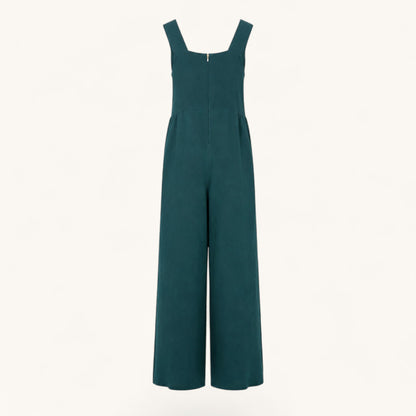 Feather & Sole teal linen jumpsuit featuring a square neckline, wide legs, and a back zipper closure.