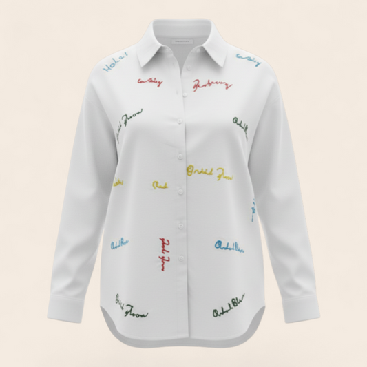 Feather & Sole white 100% cotton long-sleeve shirt with multi-colored embroidered text details.